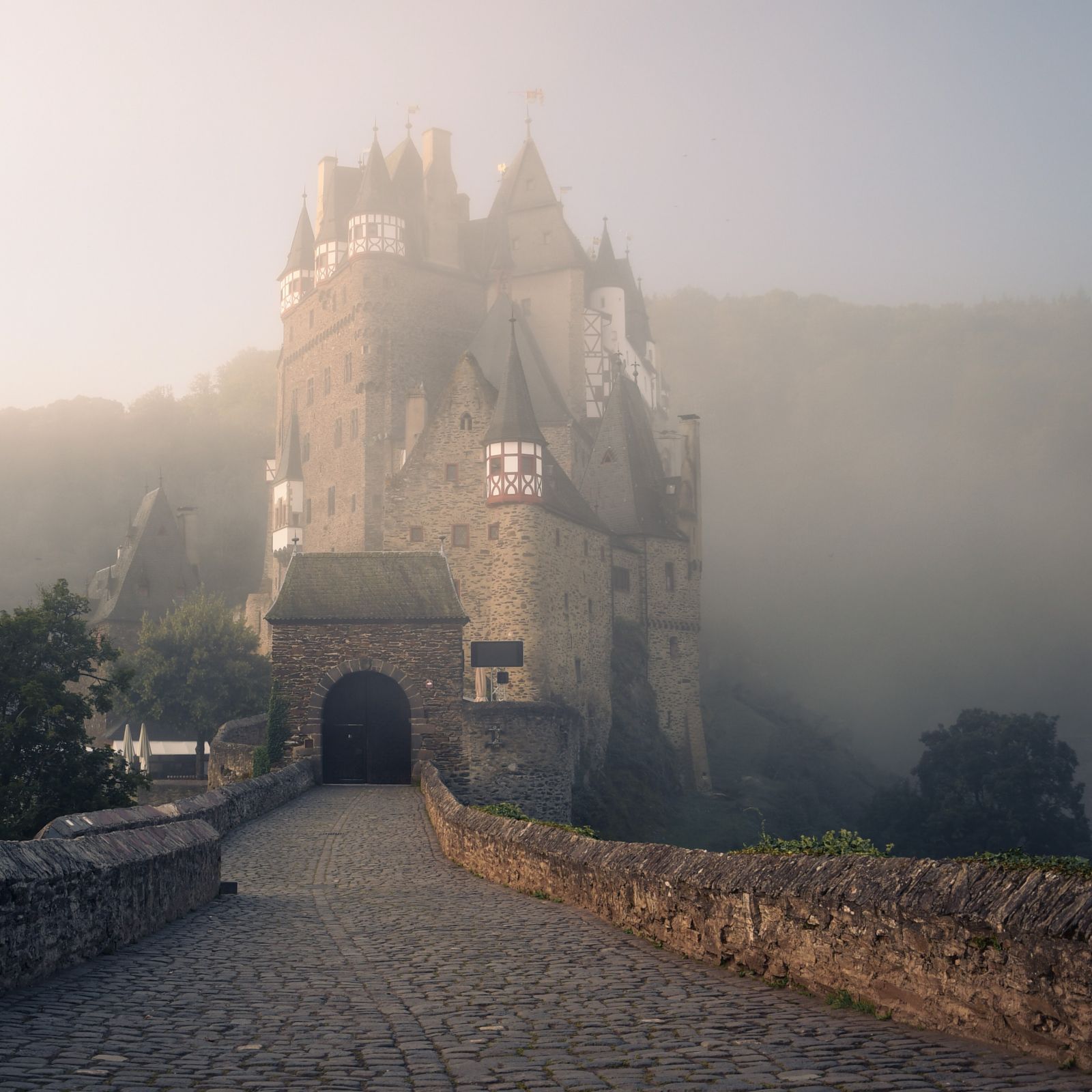 small castle enshrouded in mist